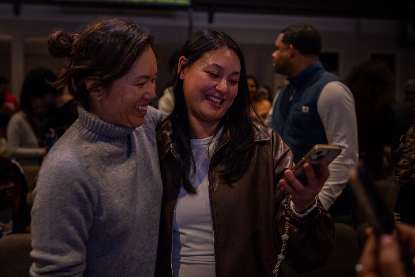 Two women sharing a smile together at Lineage